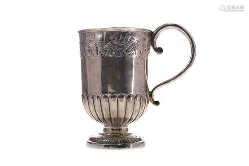 A GEORGIAN SILVER AND PARCEL GILT TANKARD