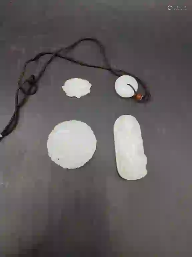 Four Chinese White Pendants