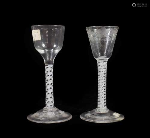 A Wine Glass, circa 1750, the rounded funnel bowl engraved with fruiting vine on an opaque twist
