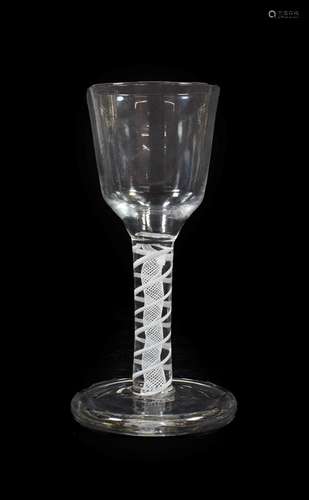 A Firing Glass, circa 1760, the ogee bowl on an opaque stem and circular foot, 15.5cm high