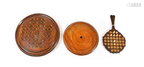 A Turned Wood Fox and Geese Board, 19th century, of circular form with drilled holes and ebonised