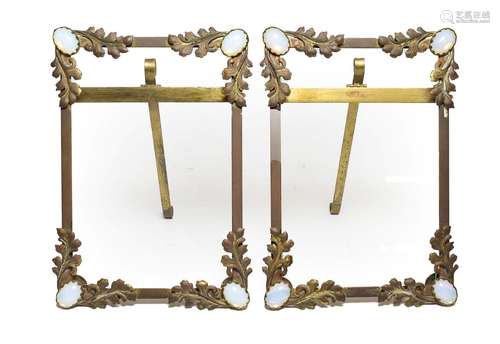 A Pair of Victorian Gilt Metal Easel-Back Photograph Frames, of rectangular form, the angles opaline