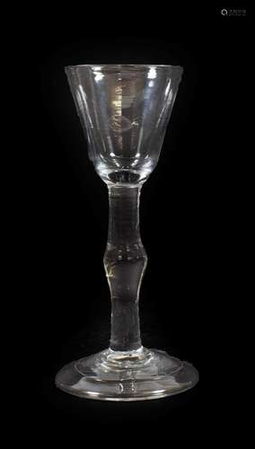 A Cordial Glass, circa 1760, the rounded funnel bowl on a knopped plain stem and folded foot, 14.5cm