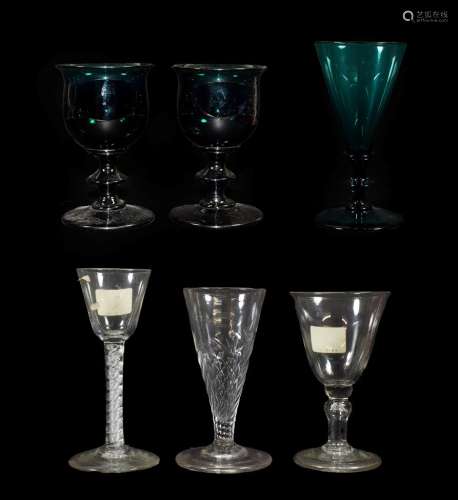 A Pair of Green Glass Wine Glasses, early 19th century, the ovoid bowls with everted rims on blade