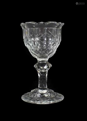 A Sweetmeat Glass, circa 1790, the ogee bowl with geometric cutting on a faceted knopped stem and