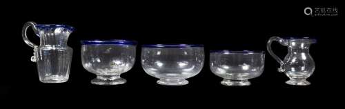 A Glass Cream Jug and Sugar Bowl, circa 1800, of fluted form with blue glass rims, jug 11cm high,