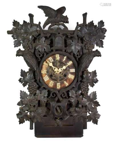 A Black Forest Cuckoo Striking Wall Clock, circa 1890, elaborately carved decorated front mounts