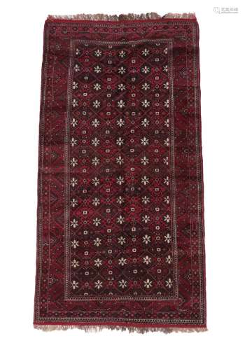 Baluch Rug Afghan/Iranian Frontier, circa 1950 The stepped diamond lattice field of flower heads