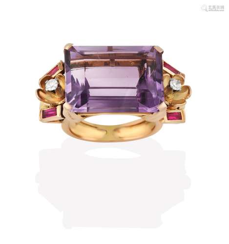 An Amethyst Ring, the emerald-cut amethyst in a yellow claw setting, flanked by foliate motifs