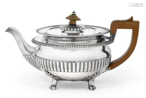 A George III Silver Teapot, by John Foskett and John Stewart, London, 1809, circular and on four paw