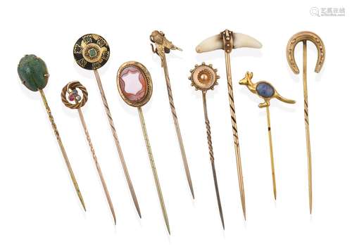 A Collection of Nine Stickpins, comprising of a cornelian cameo shield example; a scarab example; an