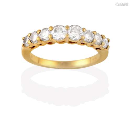 A Diamond Eight Stone Ring, the graduated round brilliant cut diamonds, in yellow claw settings,