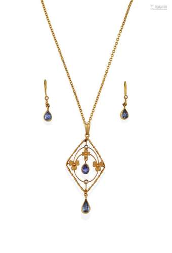 An Edwardian Sapphire and Seed Pearl Pendant on Chain, of openwork foliate lozenge design, with an