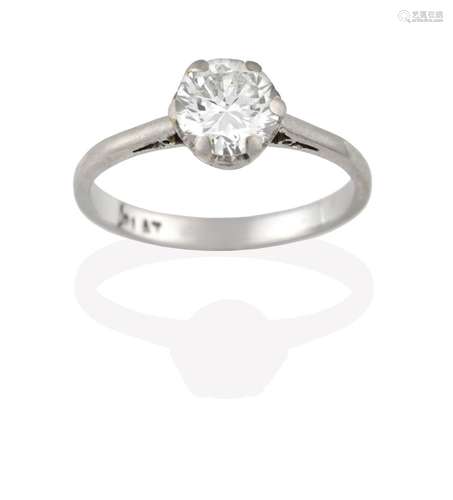 A Diamond Solitaire Ring, the old cut diamond in a white claw setting, to a tapered shoulder plain