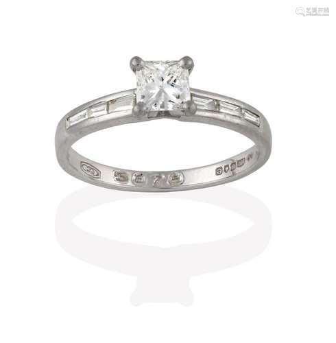 A Platinum Diamond Solitaire Ring, the princess cut diamond in a four claw setting, to baguette