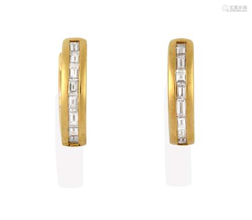 A Pair of Diamond Cuff Earrings, the baguette cut diamonds in yellow channel settings, to a hinged