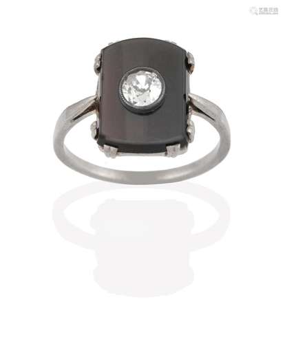 An Onyx and Diamond Ring, the oblong onyx plaque in white claw settings, with an old cut diamond set