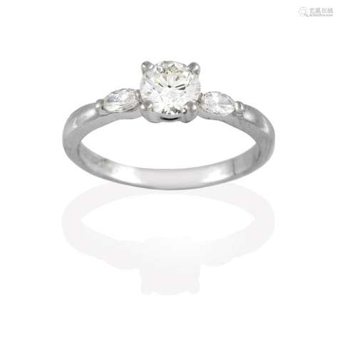 A Platinum Diamond Solitaire Ring, the round brilliant cut diamond in a claw setting, to marquise