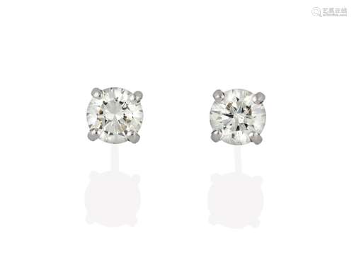 A Pair of 18 Carat White Gold Diamond Solitaire Earrings, the round brilliant cut diamonds in four