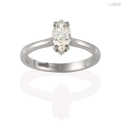 A Diamond Solitaire Ring, the marquise cut diamond in a white claw setting, to a tapered shoulder