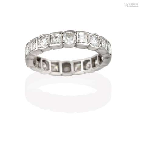 A Diamond Eternity Ring, the continuous band formed of round brilliant cut diamonds alternating with