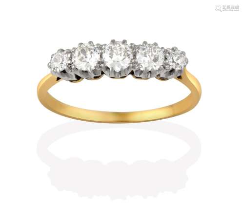 A Diamond Five Stone Ring, the old cut diamonds in white claw settings, to a yellow tapered shoulder