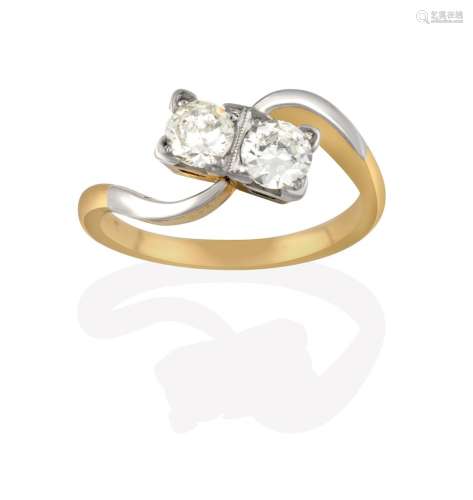 A Diamond Two Stone Twist Ring, the round brilliant cut diamonds in white claw and millegrain