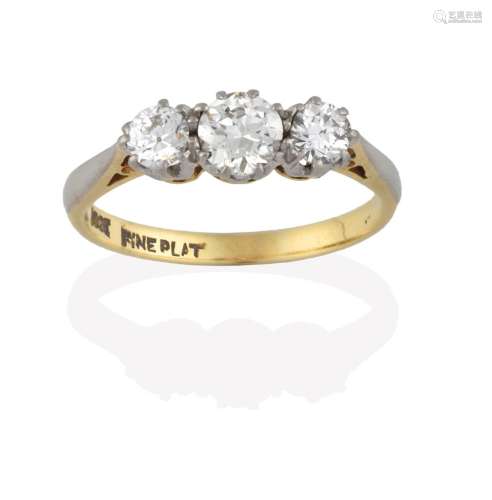 A Diamond Three Stone Ring, the graduated round brilliant cut diamonds in white claw settings, to