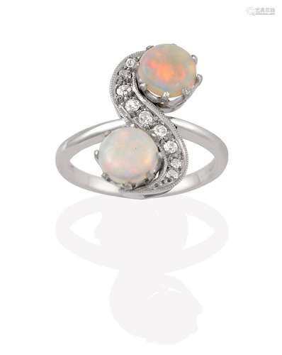 An Opal and Diamond Ring, the S-shaped twist composed of old cut diamonds terminating to round