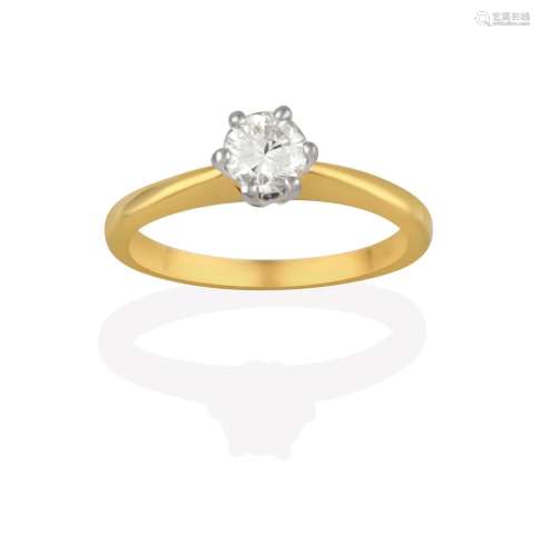 An 18 Carat Gold Diamond Solitaire Ring, the round brilliant cut diamond in a white claw setting, to