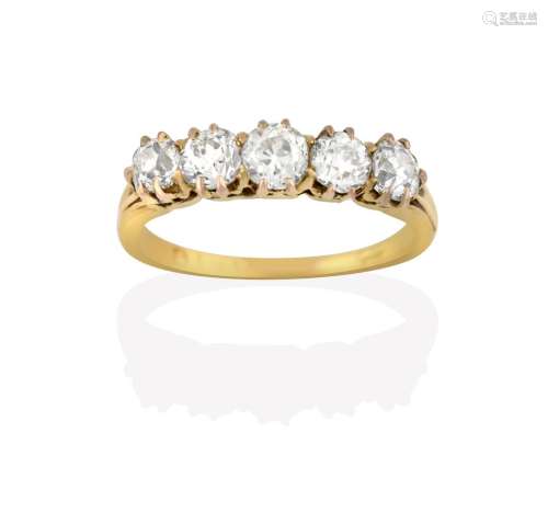 A Diamond Five Stone Ring, the old cut diamonds in yellow claw settings, to a tapered shoulder plain