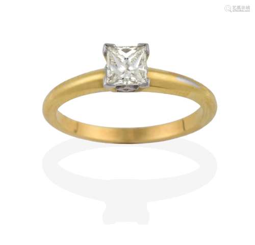 An 18 Carat Gold Diamond Solitaire Ring, the princess cut diamond in a white four claw setting, to a