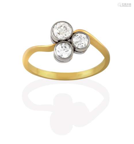 A Diamond Three Stone Ring, the old cut diamonds arranged as a cluster in white millegrain settings,