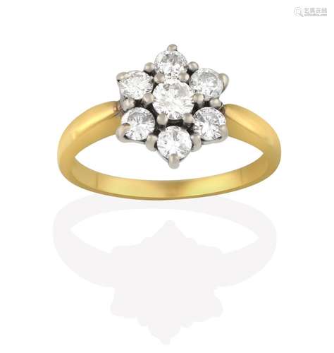 An 18 Carat Gold Diamond Cluster Ring, seven round brilliant cut diamonds, in white claw settings,