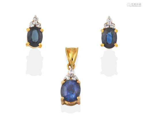 A Sapphire and Diamond Pendant, a trio of round brilliant cut diamonds in white claw settings