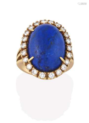 A Lapis Lazuli and Diamond Cluster Ring, the oval lapis lazuli cabochon within a border of round