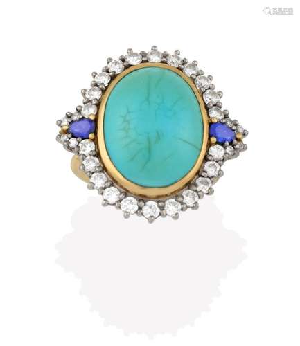 An 18 Carat Gold Turquoise, Sapphire and Diamond Cluster Ring, the oval turquoise cabochon in a