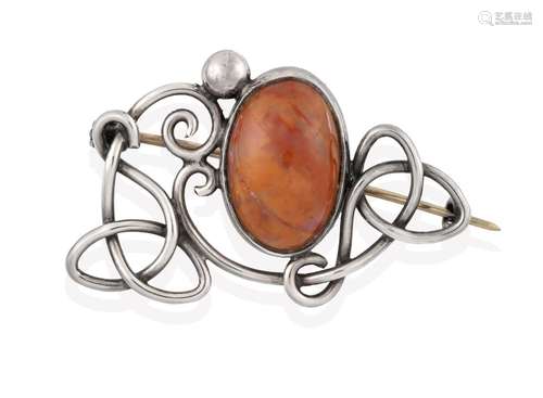 An Arts & Crafts Style Agate Brooch, an oval cabochon agate centrally in a white collet setting,