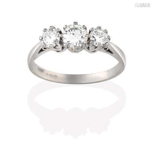 An 18 Carat White Gold Diamond Three Stone Ring, the graduated round brilliant cut diamonds, in claw