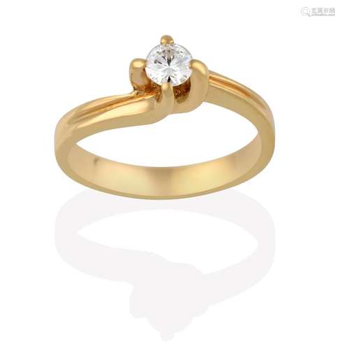 A Diamond Solitaire Ring, the round brilliant cut diamond in a yellow four claw setting, to an