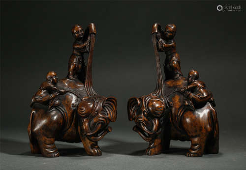 Pair Of Chinese Agalwood Carved Ornaments, Children Riding On Elephant’s Design