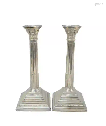 A Pair of English Silver Candlesticks with stepped