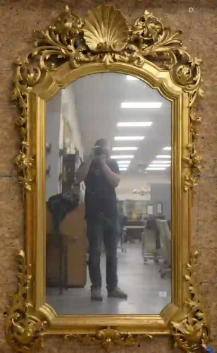 Carved Giltwood Mirror having large top center shell,