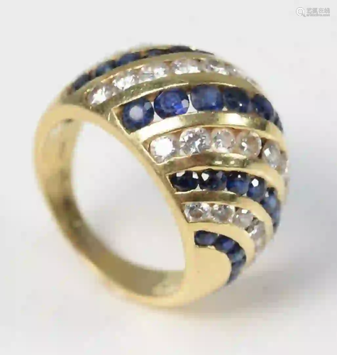 18 Karat Gold Dome Ring set with blue sapphires and