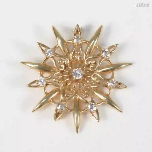 14 Karat Gold Brooch set with eight diamonds 11.5