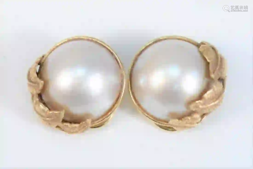 Pair of 14 Karat Gold Earrings each set with large