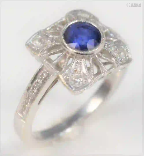 18 Karat White Gold Ring with center blue sapphire,