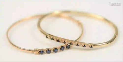 Two 14 Karat Gold Bangle Bracelets each set with blue