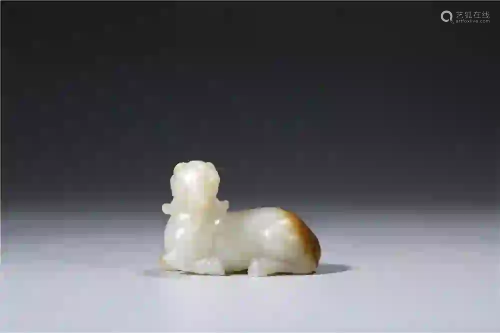 CHINESE. A WHITE JADE GOAT WITH RUSSET