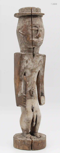 Male figure with sword and western hat. Probably the